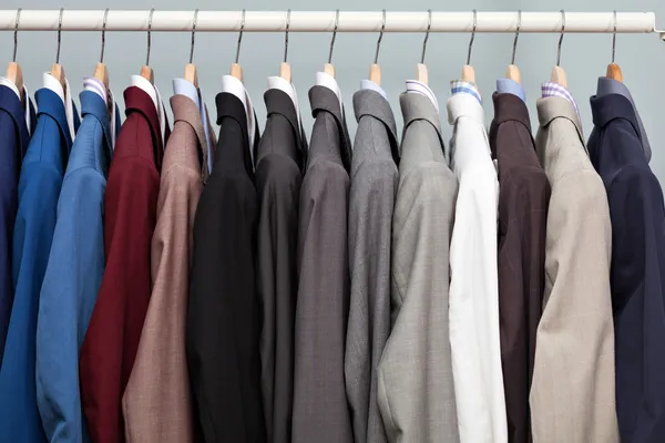 Display of man suits in a closet
