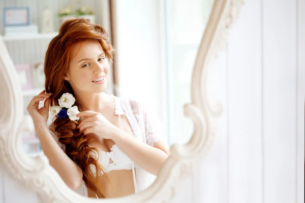 Hair stylist makes the bride on the wedding day