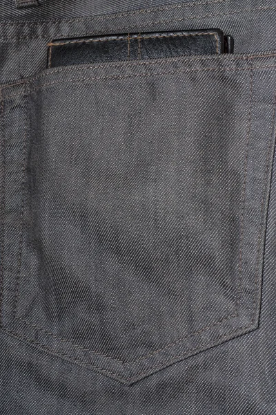 Black wallet in the back pocket of jeans