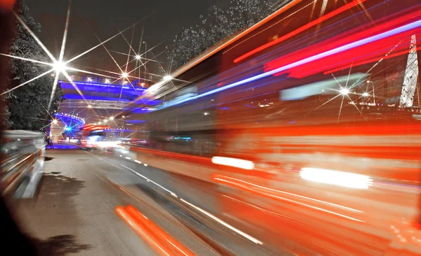 High-speed vehicles blurred trails on urban roads