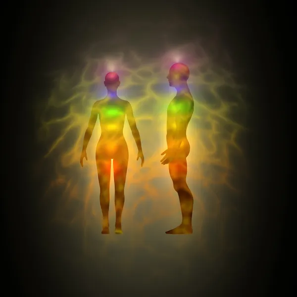 Human energy body silhouette with aura and chakras
