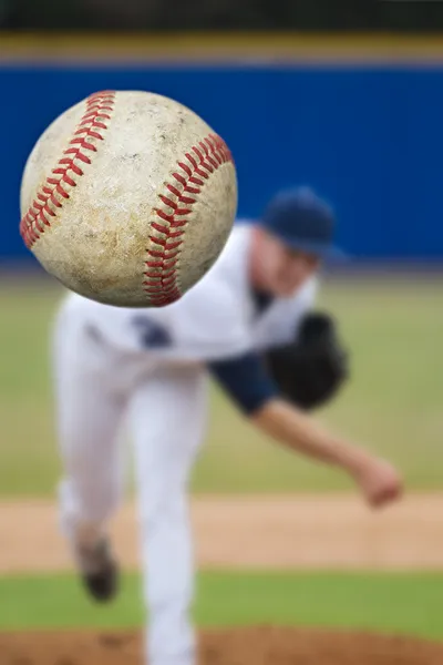 Baseball pitcher throwing ball