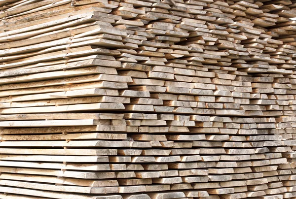 Stack of wood planks for construction buildings and furniture production