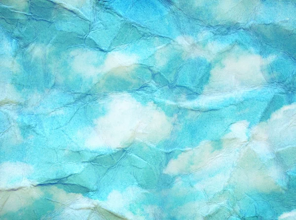 Vintage clouds and sky painted on crumpled paper texture.