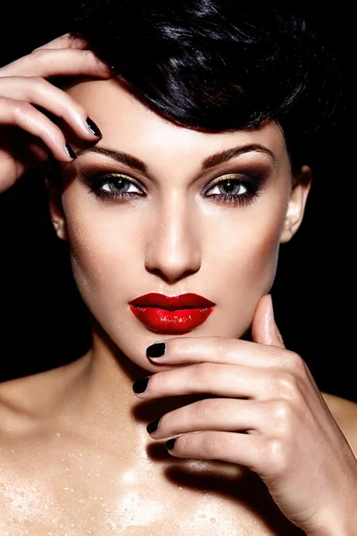 High fashion look.glamor closeup portrait of beautiful sexy brunette Caucasian young woman model with bright makeup, with red lips, with perfect clean skin