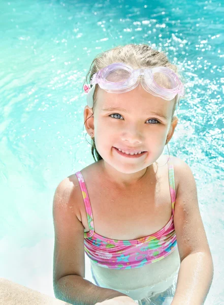 Cute little girl in swimming pool