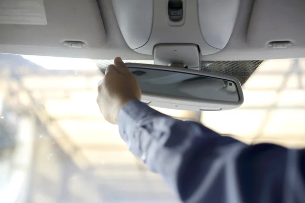 Business man hand holding mirror