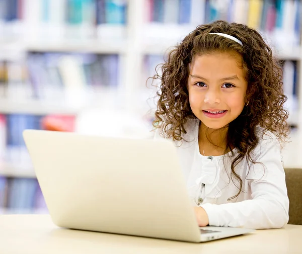 Girl using a laptop computer Girl using a laptop computer