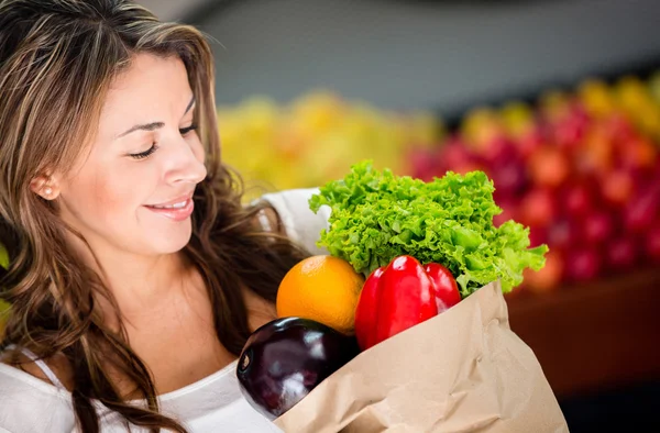 Woman buying vegetables Woman buying vegetables