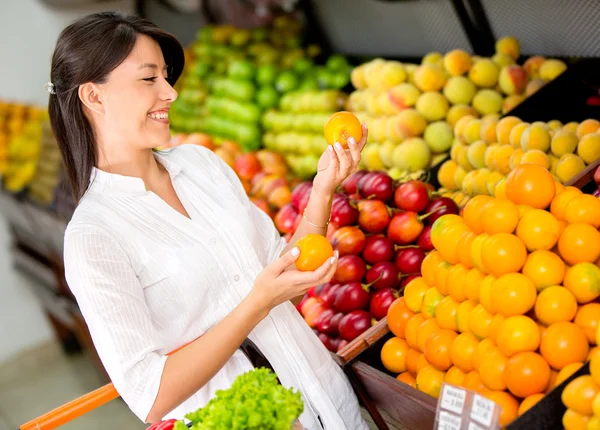 Woman buying fresh fruit Woman buying fresh fruit