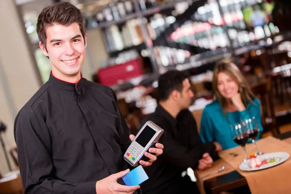 Waiter taking a payment Waiter taking a payment