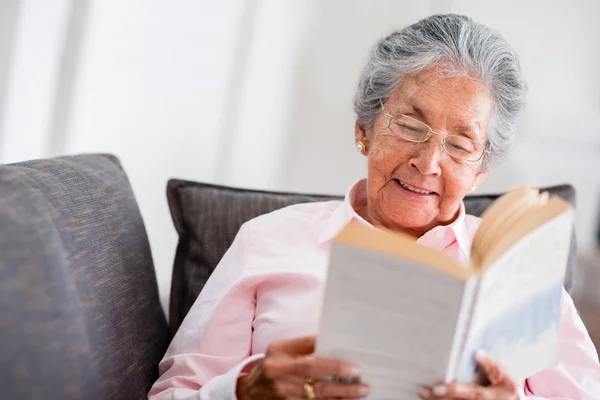 Elder woman reading a book
