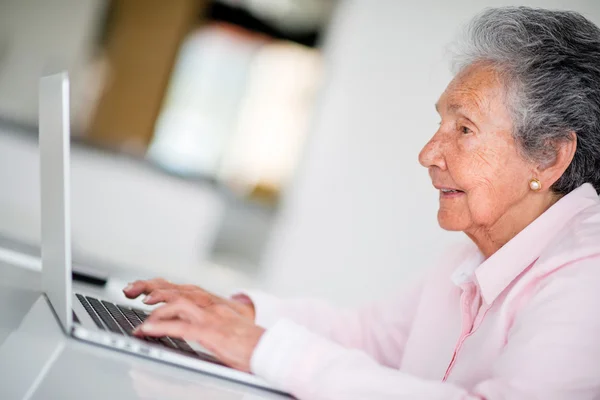 Elder woman using a computer