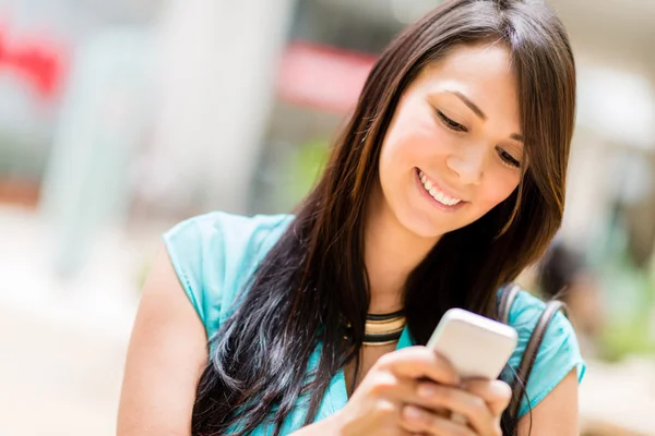 Woman sending a text message