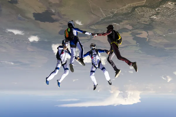 Parachutist build a figure in free fall.