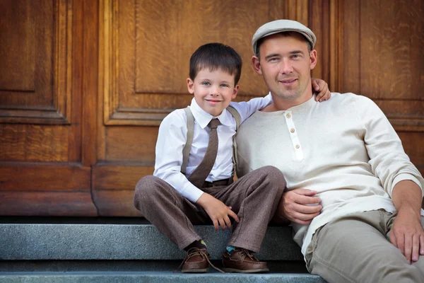 Father and son enjoying summer day in city