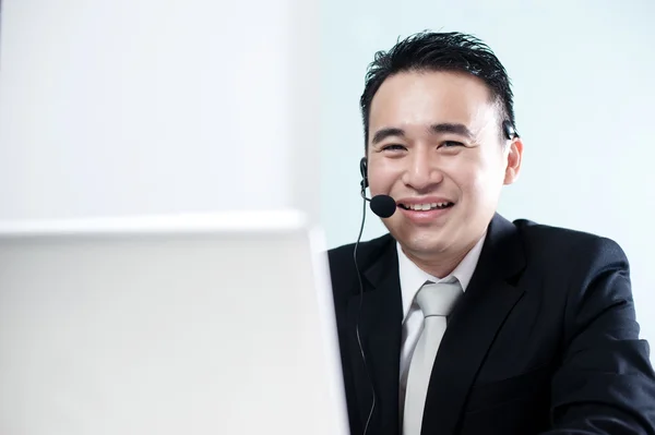 Asian support call center worker