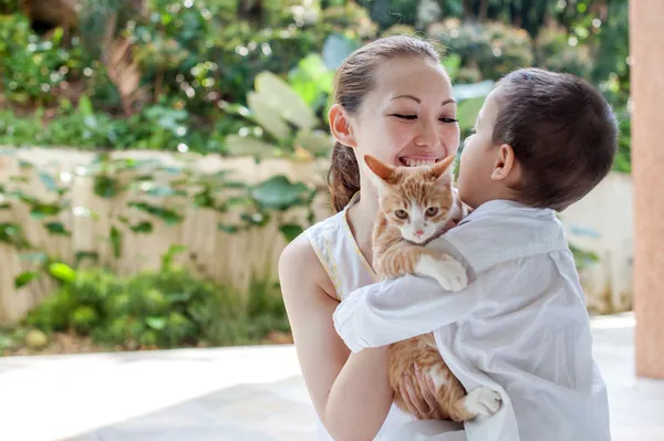 Asian mother with son and cat