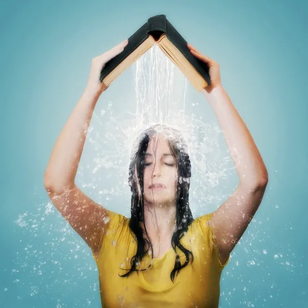 Bible with water falling on woman\'s head.