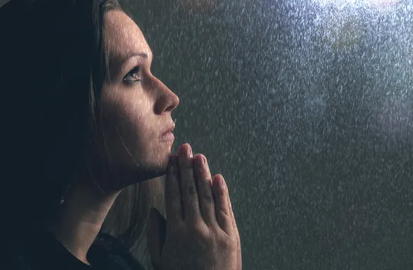 Praying in the rain