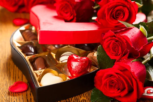 Box of chocolate truffles with red roses