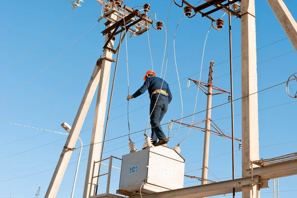 Electricians performs work at height