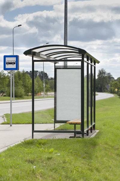 Bus stop with the ad in suburb