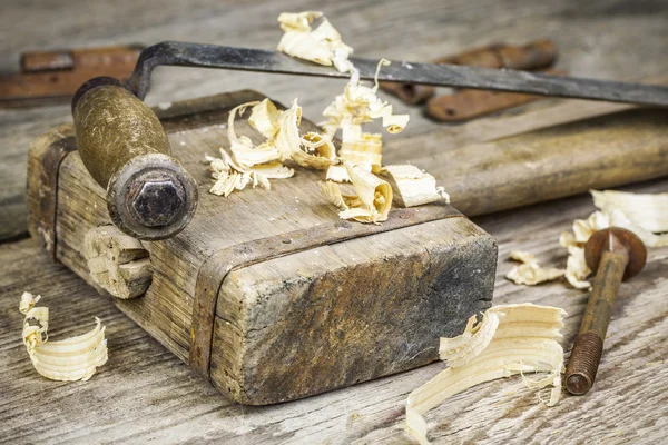 Old carpenter's hammer with other carpentry tools