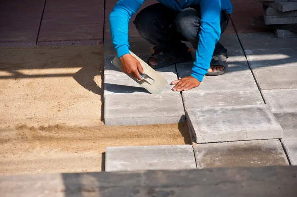 Tile for floor construction