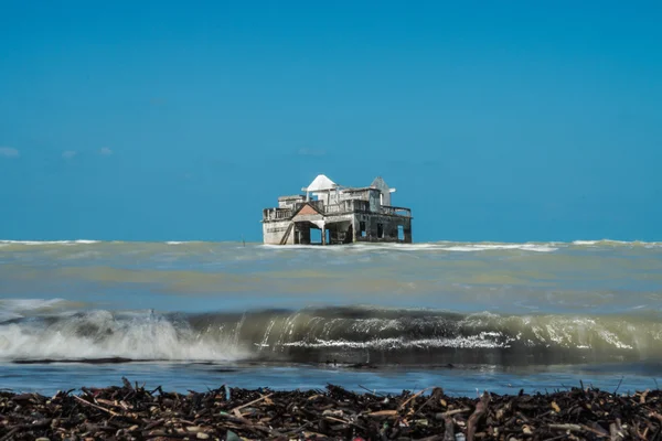 Global warming and monsoon Destroyed houses near the coast, Thai