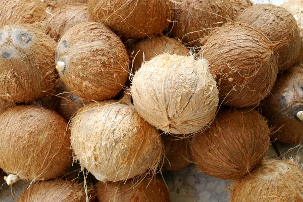 Peeling coconuts fruit background