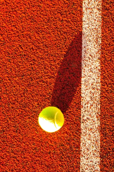Tennis ball near the out line