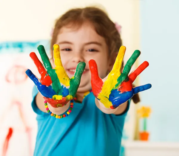 Happy child with painted hands