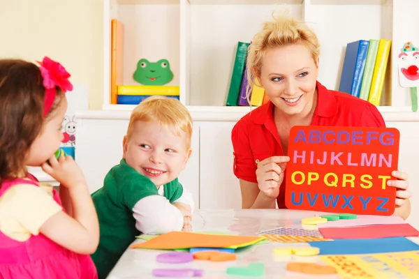 Pre-school children in the classroom with the teacher