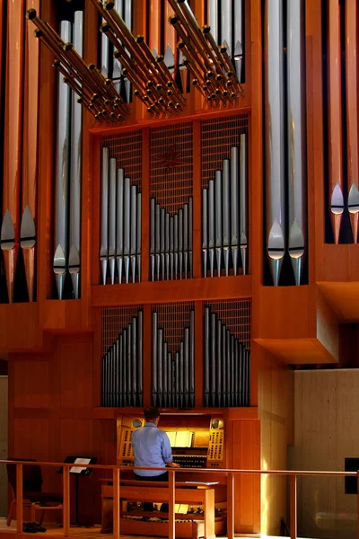 Man playing organs in Milwaukee church