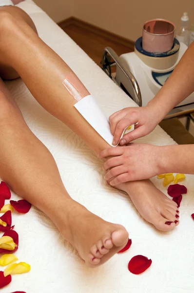 Depilation with wax in beauty salon