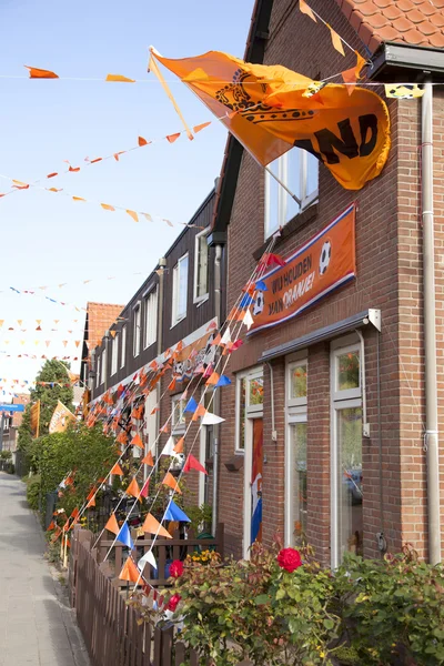 Orange flags against houses in holland