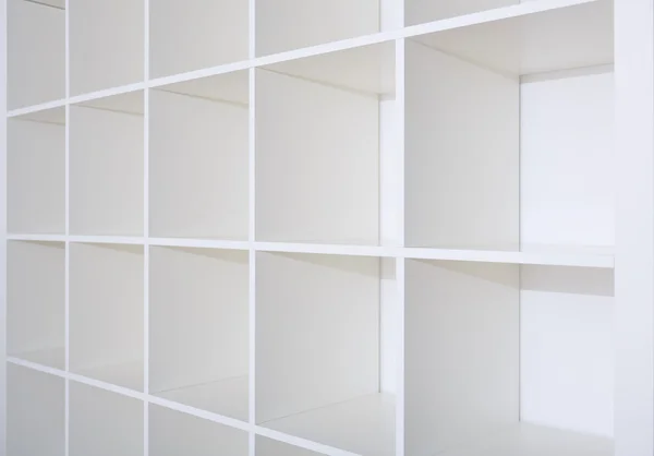 Blank white bookshelf, empty shelves