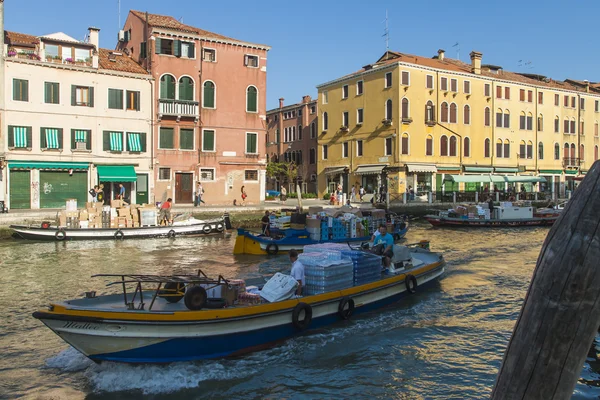 Venice, Italy . June 22, 2012 . Cargo boats carry about products on the canals of Venice