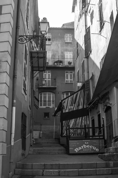 Nice, France, on July 3, 2011. Narrow street in the old city. Black-and-white image