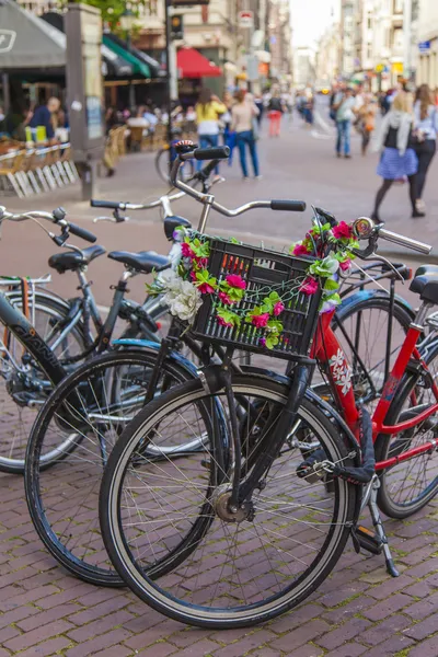Amsterdam, Netherlands, on July 7, 2014. Bicycle parking on the old narrow city street.
