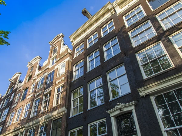 Amsterdam, Netherlands, on July 10, 2014. Typical architectural details of old buildings on the bank of the channel