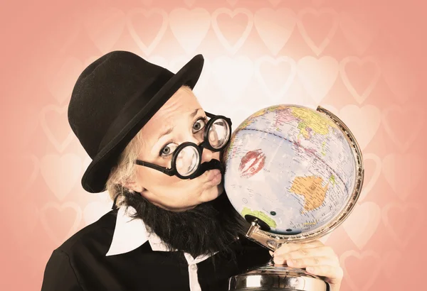 Comical nerdy person kissing the globe
