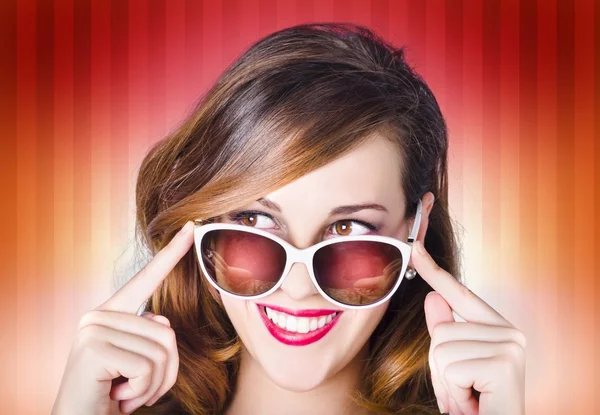 Face of a retro pinup girl in trendy sunglasses