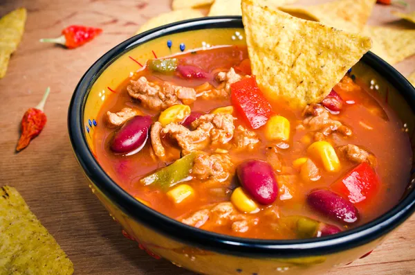 Mexican soup with tacos