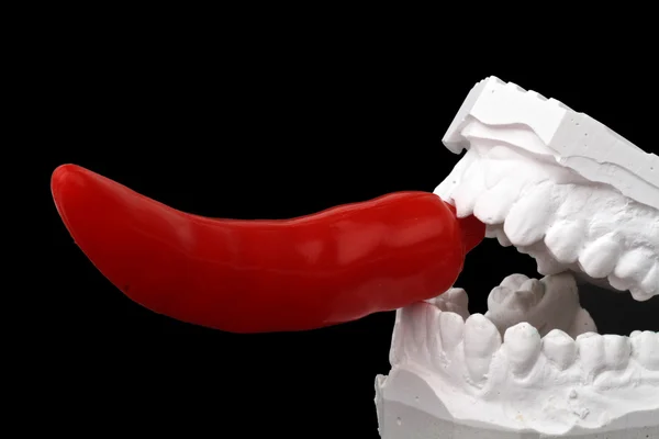 Dental impression with red hot chili pepper