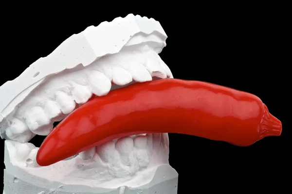 Dental impression with red hot chili pepper