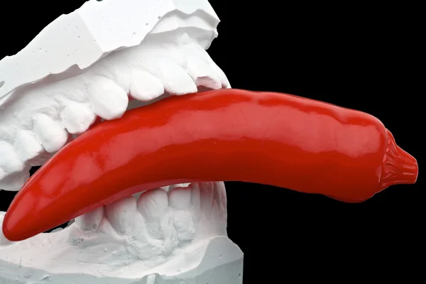 Dental impression with red hot chili pepper