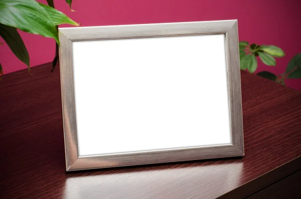 Silver photo frame on dresser