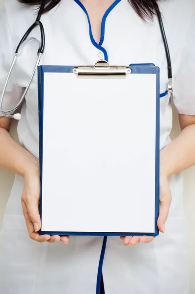 Doctor with blank clipboard